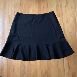 Vince Camuto lined black skirt with fun bottom flounce. Excellent condition.